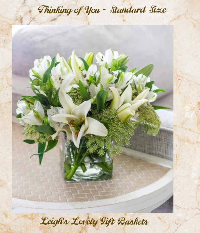 Thinking of You - Standard Size

A beautiful way to send your thoughts, this stunning arrangement features beautiful white lilies, white alstroemeria, queen anne's lace, lily grass, and curly willow in a clear glass cube vase. Measures approximately 9"H x 10"W x 10"D.

Includes:
• White Lilies
• White Alstroemeria
• Queen Anne's Lace
• Glass Vase

Delivery from Floral network $18.95
Same Day Delivery before 10: AM Order