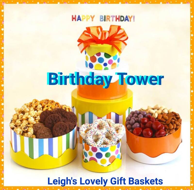 Birthday tower in bright colors with stripes and circles and orange and yellow bow. 