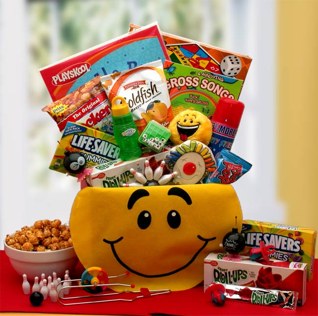 Smiley Face Gift Box is filled with Playskool doodle pad, children's board game (assortments include checkers chutes and ladders Bingo), Annoying and Gross Songs CD for Kids with activity book, silly string, word jumble puzzle cube game, miniature hopping and popping bombs, finger bowling game, smiley face kick ball, and sweets. 