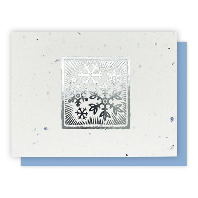Foil Snowflake Card -5 pack is sa foil  snowflake print on a blue speckled background. Card is embedded with wildflower seeds. Select the Holiday Greeting Cards category 