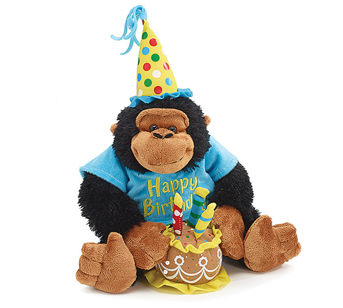 12 inch Black and brown monkey wears a polka dot party hat and blue tee shirt with "Happy Birthday" .Monkey is holds a cake with 3 candles on top and plays Happy Birthday Song.
