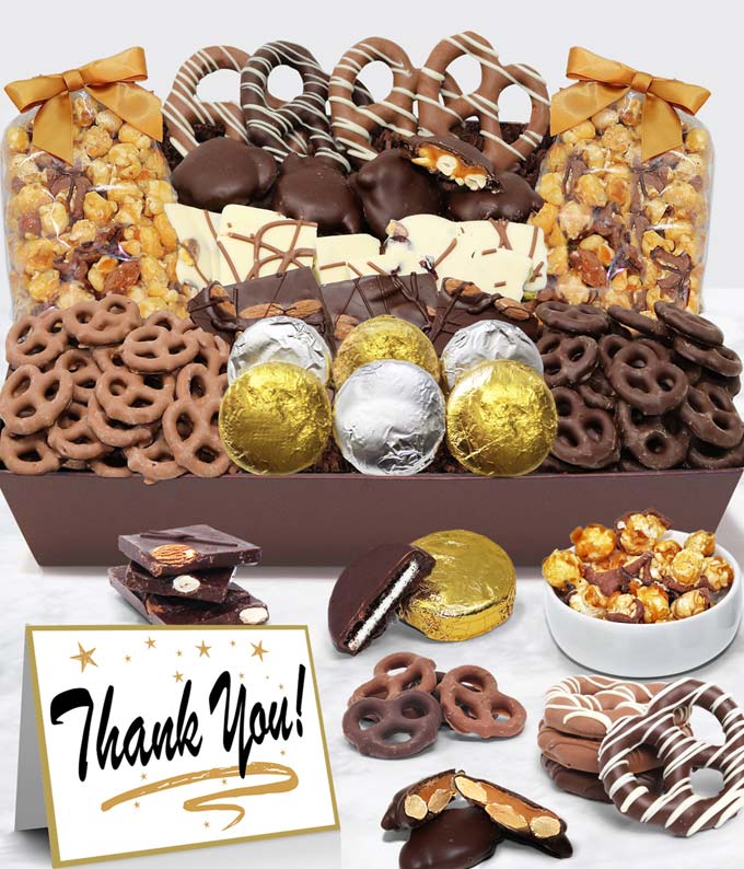 
THANK YOU Belgian Chocolate Covered Snack Tray

Say Thank You in a BIG way with the Congrats - Belgian Chocolate Covered Snack Tray! These goodies are handcrafted by artisans in a small batch kitchen. Light up their day with this special gift. OREO® is a registered trademark of Mondelēz International Group.

Includes:
• 6 OREO® Cookies Covered in Belgian Milk Chocolate
• Belgian Milk Chocolate Covered Mini Pretzels
• Belgian Dark Chocolate Covered Mini Pretzels
• 8 Large Pretzel Twists covered in Milk and Dark Belgian Chocolate
• Belgian Dark Chocolate Almond Bark
• Belgian White Chocolate Cranberry Pistachio Bark
• Caramel Popcorn drizzled with Belgian Milk Chocolate
• Caramel Popcorn drizzled with Belgian Dark Chocolate
• 4 Caramel and Nut Clusters
• Includes a Thank You Card
• Arrives in an Elegant Tray

ALLERGEN ALERT: Product contains egg, milk, soy, wheat, peanuts, tree nuts, and coconut. We recommend that those with food-related allergies take precautions.