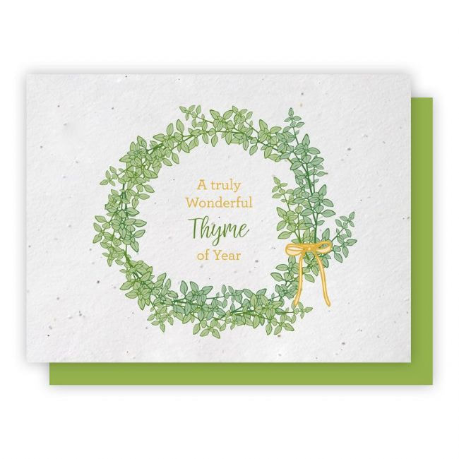 Thyme of the Year - 5 Pack . A simply beautiful wreath of thyme leaves tied with a golden yellow bow. " A truly wonderful Thyme of the Year" message on a white background. Card is embedded with thyme seeds. Select the Holiday Greeting Cards category.