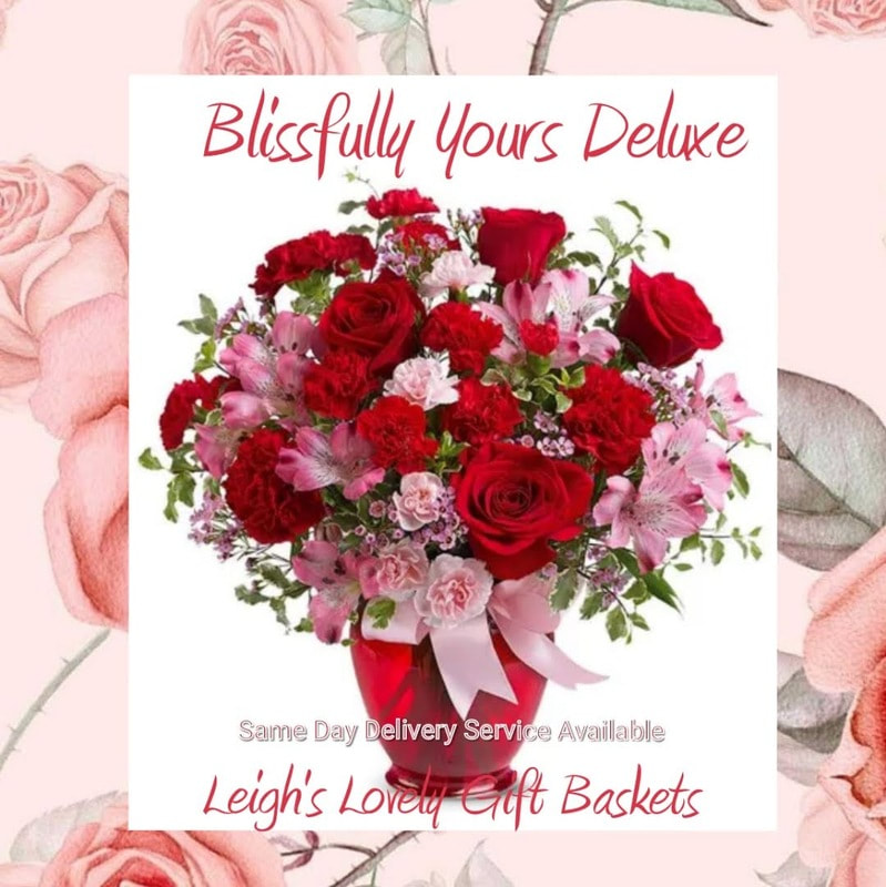 Blissfully Yours Deluxe will  capture her heart in pinks and reds. Includes Red Roses, Pink Alstroemeria,
Red Carnations and Pink Waxflower arranged and delivered in a  Red Vase with Ribbon by  local network florist with Same Day Delivery Service Monday through Friday. 