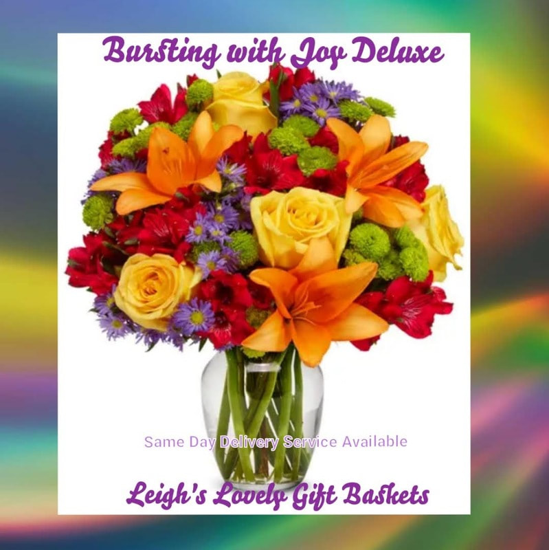 Bursting With Joy Deluxe bursts forth with jubilant color!  Bouquet includes Yellow Roses,
Orange Lilies, Red Alstroemeria,
Green Buttom Poms, and Purple Monte Casino arranged in a clear glass vase fur delivery by a local network florist, Same Day Delivery is avaiiable Monday through Friday, 