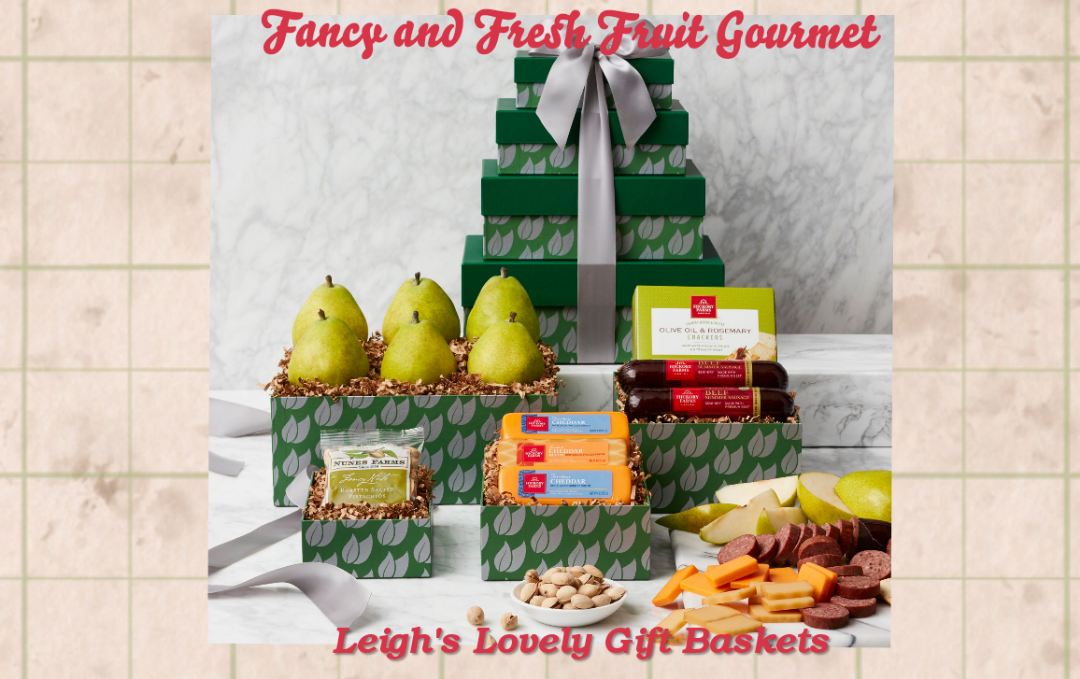 Green and silver print gift box tower is accented with a silver ribbon bow. Includes 6 Fresh Pears, 2 Sausages, Crackers, 3 Gourmet Cheese, and Roasted Nuts 