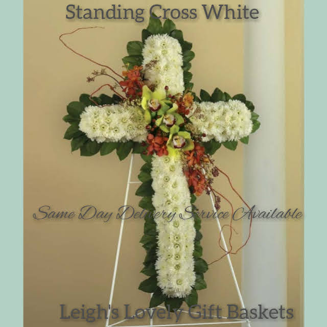 Standing Cross White is a beautiful  testimony of faith in White Cushion Poms, Green Cymbidium Orchid and Red Novelty Orchids Same Day Delivery Available