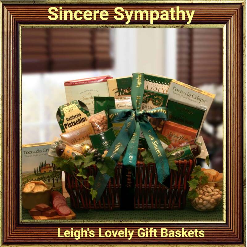 Sincere Sympathy Sincerest Sympathy Gift Basket. Dark stained, willow gift tray, offers gourmet treats  and is tied with a printed sympathy bow and sash.  Includes
California pistachios, Havarti cheese spread,  Bavarian beef salami, Bavarian summer sausage, Creamy Italian Herb cheese spread, Focaccia parmesan crackers, Cranberry harvest fruit and nut snack mix, Olympos pimento stuffed Mediterranean olives, Chanberry French truffles, Lindor white chocolate truffle, Ghirardelli caramel square, Ghirardelli mint filled milk chocolate square, Deluxe assorted nuts, English select tea, Honey sweet peanuts, Smoked almonds, Toffee and chocolate covered cookies, and Biscoff European butter crisp cookies.