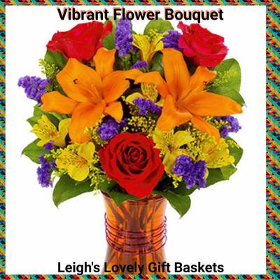 Vibrant Flower Bouquet creates a dramatic focal point in any room with  Orange Lilies, Hot Pink Roses, Yellow Alstroemeria and
Purple Statice arranged in an orange glass vase. Same Day Delivery Service available. 