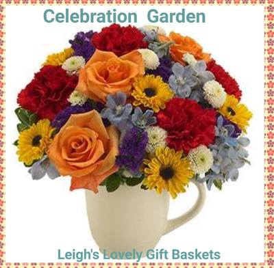 Celebration Garden Bouquet with Orange Roses, Red Carnations, Purple Statice and Blue Delphinium arranged in a white coffee mug.   Same Day Delivery Service available
