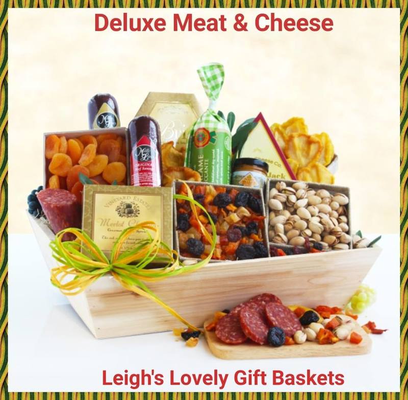 Natural wooden crate holds a savory assortment of snacks including Jack, Merlot Cheddar and Brie Cheese Spreads, 
Summer Sausage,Mustard Dried Apricots,Pears, and Mixed Fruit and
Pistachios,