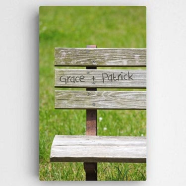  Gallery wrapped canvas print features a weathered park bench with names shown as hand carved for a personal feel.