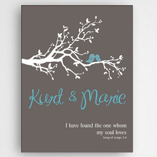 Stretched canvas with chalkboard paint look finish includes couples names in contrasting blue and a poem