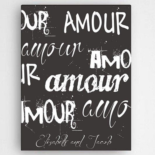 Chalkboard look canvas says" Our amour" in varied text styles. Personalized with couples names 
