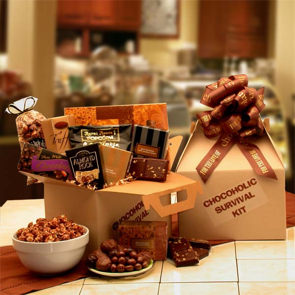 Serious aid for chocolate cravings!  Kraft gift box with chocolate colored printed bow is filled with Nutty caramel clusters, Coconut and Peanut Butter cream chocolates,
Peanut Butter Cream  chocolates, Double Chocolate truffles
Chocolate brownies,
Almond Rocca,
Chocolate covered almonds,Chocolate cover popcorn and
Rocky Road popcorn 