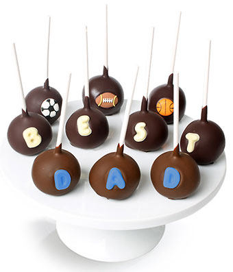  10 Father's Day Cake Pops are covered in Milk and Dark Belgian Chocolate and decorated with edible chocolate letters and three sports ball designs
Shipped in a reusable cooler with Next Day Delivery Service