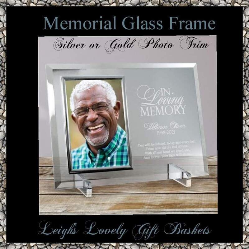 Memorial Glass Frame with Silver or Gold Photo Trim with free engraving. 
Beveled Glass Picture Frame is made of heavy-weight glass and features beveled edges on all four sides and your choice of golden or silver brass trim around your photograph
Measures 8" x 11" and holds a 4" x 6" photograph.
Includes clear easel legs for tabletop display
Personalization is etched directly in the glass. This item does not offer a color fill.  Personalize with name, year of birth and year at rest. 