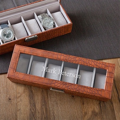 Brown Men's Crocodile Watch Box $53.99 Faux leather top stitched case with glass hinged lid has 6 suede like removable velvet watch cushions and a polished nickle clasp closure. Personalize with one line of up to 15 characters.