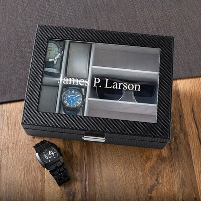 Men's Watch Box with Sunglasses Holder  $58.99  Handsomely designed holder with  glass hinged lid, 4 khaki suede-like removable velvet watch cushions, polished  nickel locks. Personalize with one line up to 20 characters.

