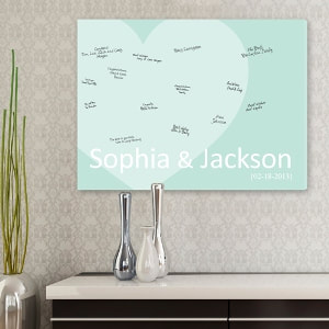 Pale sea green canvas features a large heart, couple"s first names  and wedding date personalization. Guests can sign the canvas, making it a memorable wall canvas for the couple's home! 