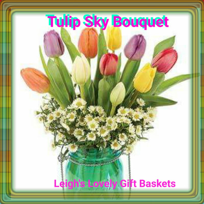 Tulip Sky  Bouquet is jaunty and colorful with Mixed Tulips and White Monte Casinos arranged in a Blue Mason Jar. Same Day Delivery Service available