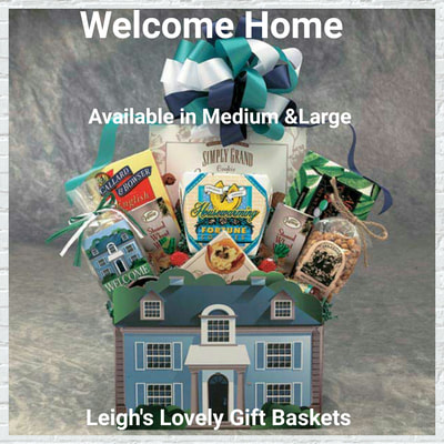Welcome Home Gift Box. Colonial Home gift box with gourmet snacks and teal and white bow. 