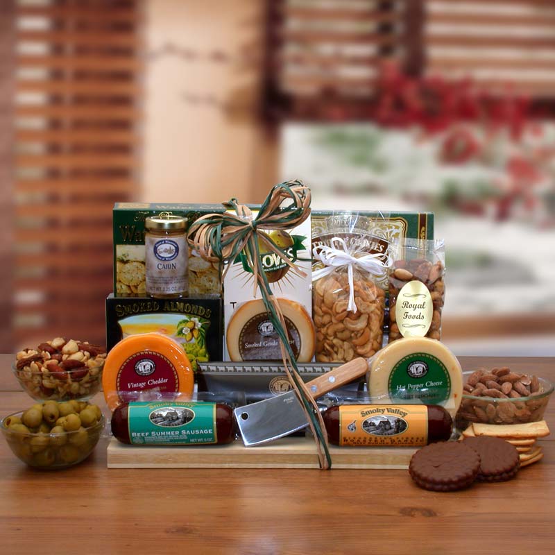 Brown gift tray is wrapped with cellophane and is topped with a tan raffia bow. includes Tropical Trail Mix, Deluxe mixed nuts, onion and garlic cheese round, garden vegetable swiss cheese round, roasted garlic cheddar cheese squares,  Beef salami with garlic,  Beef Summer Sausage, Hickory sticks,  jalapeno beef sticks, Three pepper water crackers. 