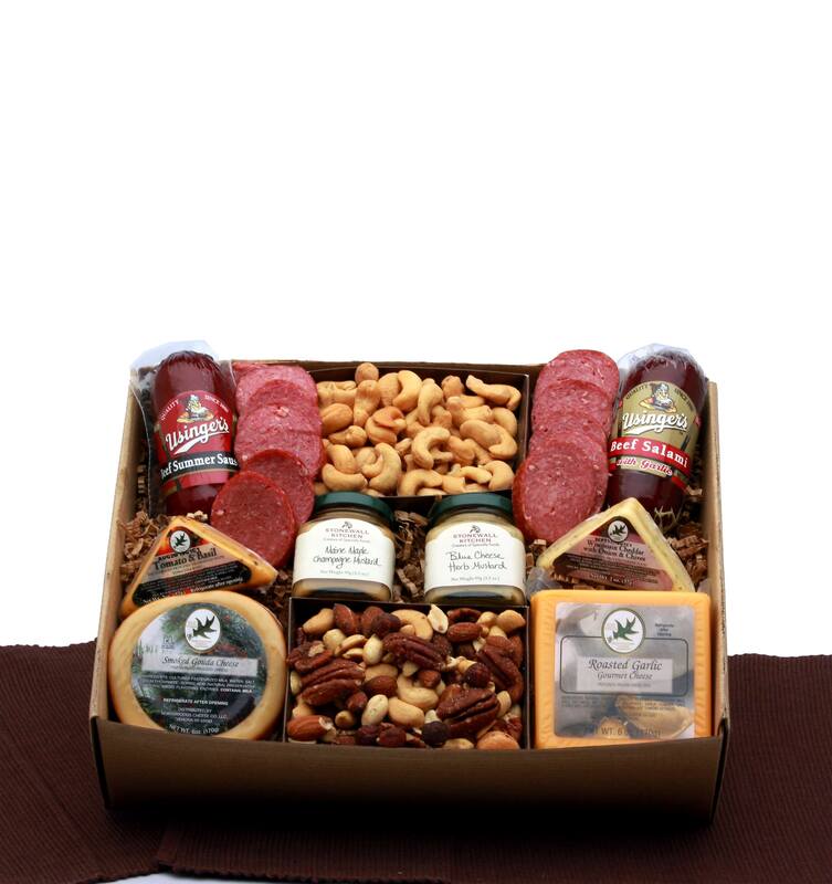 Tan gift box measuring 12 x 9, is wrapped in cellophane and topped with a handmade natural raffia bow. Includes Usinger's  all beef summer sausage,  Beef salami with garlic, tomato basil cheese triangle,  Wisconsin white cheddar with garlic and onions triangle, Blue cheese herb mustard, maple Maine champagne mustard, salted cashews, salted deluxe mixed nuts,  smoked Gouda cheese round,  Roasted garlic cheddar cheese square. 