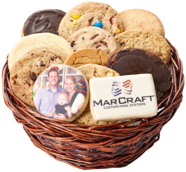 Custom logo or photo event cookies are individually bagged in sets of twelve and presented in a wicker basket with a gift bow.