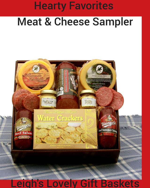 Brown gift box tray includes Usinger's beef Salami with garlic, Usinger's  Beef summer sausage, Usinger's famous biased cut farmer's sausage,  Three Pepper water crackers, stone ground mustard, Bavarian mustard,  Wisconsin's Best Cheddar round, and a Smoked Gouda cheese round.
Classic silver metal gift box with lid holds a variety of delicious savory snacks. Includes Usinger's Beef summer sausage, Maine Maple Champagne mustard, Mozzerella cheese bar, smokey Wisconsin cheddar bar, pistachios, mixed nuts, Three Pepper water crackers. 
  Click here to connect to Leigh's online gift boutique. Select Gift Baskets from the Shop Menu
Select Meat, Cheese & Nuts Gift Ideas category. 