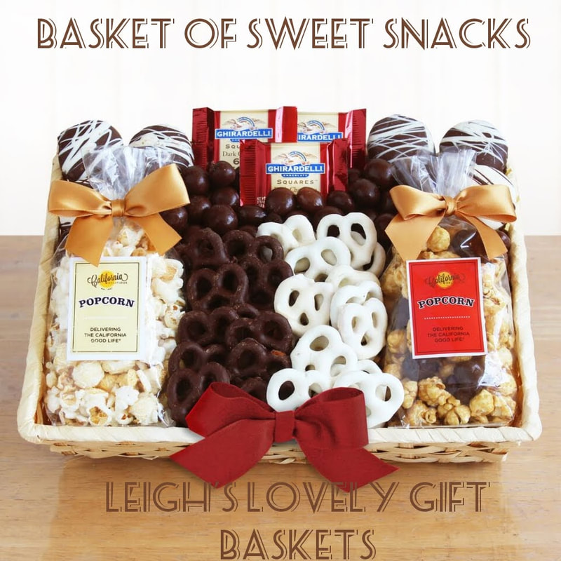Natural woven tray basket with red bow is filled with gourmet popcorn, white and milk chocolate-covered pretzels, chocolate-covered sandwich cookies and Ghirardelli chocolate squares