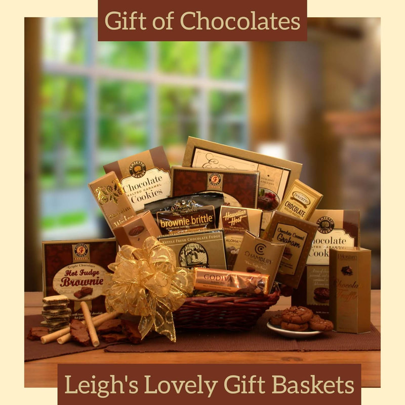 Dark willow tray holds a variety of decadent chocolate treats and is topped with a sheer printed gold bow. Enjoy  cookies, fudge cake, brownie, grahams, truffles, nuts, Brownie Brittle and more! 
Click here to visit Leigh's online gift boutique! Select Gift Baskets from Shop Menu
Select All Gift Basket Gift Ideas
Select Gourmet Baskets/ Box Towers
Select Chocolates, Nuts & Sweets 
