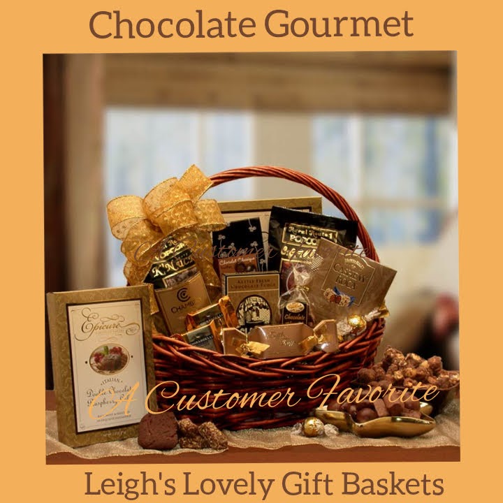 Dark stained gift basket holds a  delectable medley of treats that pair chocolate with caramel, marshmallow, peanut butter and nuts. Handmade gold bow tops the handled basket.
Click here to visit Leigh's online gift boutique! Select Gift Baskets from Shop Menu
Select All Gift Basket Gift Ideas
Select Gourmet Baskets/ Box Towers
Select Chocolates, Nuts & Sweets 