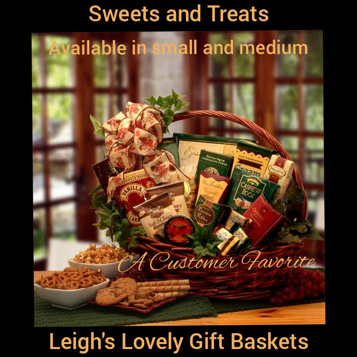 Dark stained willow handled basket is adorned with greenery and topped with a festive holiday bow. Basket holds a variety of favorite treats. Enjoy 
Old Fashioned vanilla caramels, Licorice petites candy, Petite fruit candies, Brent and Sams chocolate chip cookie, Almond roca toffee, Butter toffee pretzels, Butter toffee caramel corn, Cranberry truffles, Raspberry fudge cake,  and Clays Old Fashioned fudge. 
Click here to connect to Leigh's  online gift boutique!  Select Gift Baskets from Shop Menu
Select All Gift Basket Gift Ideas
Select Gourmet Baskets/ Box Towers
Select Chocolates, Nuts & Sweets 