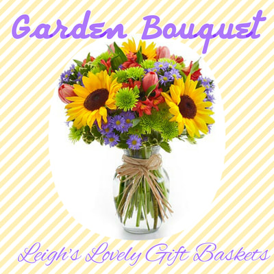 Garden Bouquet is reminiscent of hand picked flowers from the European foothills! Sunflowers,
Pink Tulips,Red Alstroemeria,Purple Monte Casino Asters and Green Poms arranged in a clear glass vase tied with Raffia. Same Day Delivery available. 