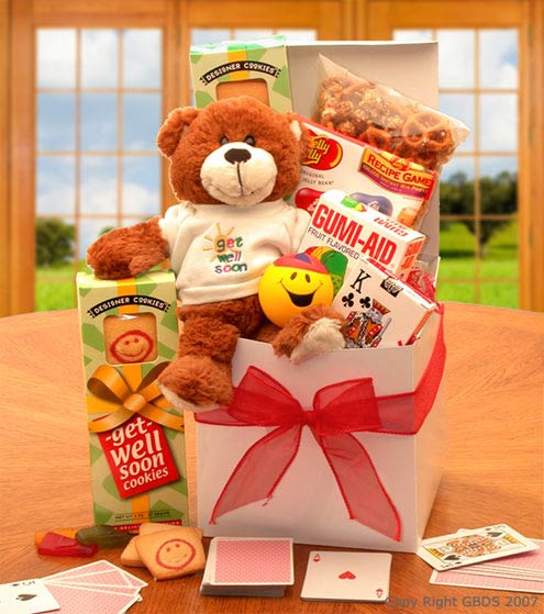 White gloss gift box holds a delightful mix of gifts to cheer up your student whose feeling under the weather. Includes Playing Cards,Get Well soon teddy Bear,Gummy Aid Gummy Band Aides,Smiley Face Stress Ball, Jelly Belly Asst Jelly Beans,Get Well Soon shortbread, cookies, and crunchy caramel corn
