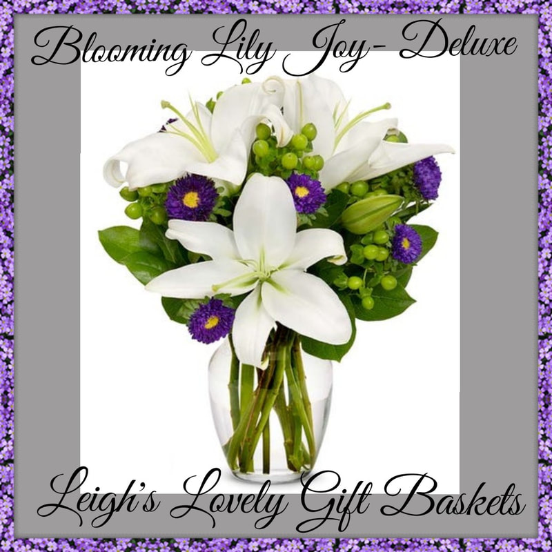 Blooming Lily Joy Deluxe with Same Day Delivery Service available. Beautiful blooming bouquet with White Lilies, Green Hypericum Berries and Purple Asters arranged in a clear glass vase. Order Monday-Friday before 10 am EST. 